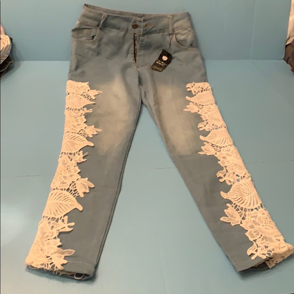 Never worn, blue jeans with lace